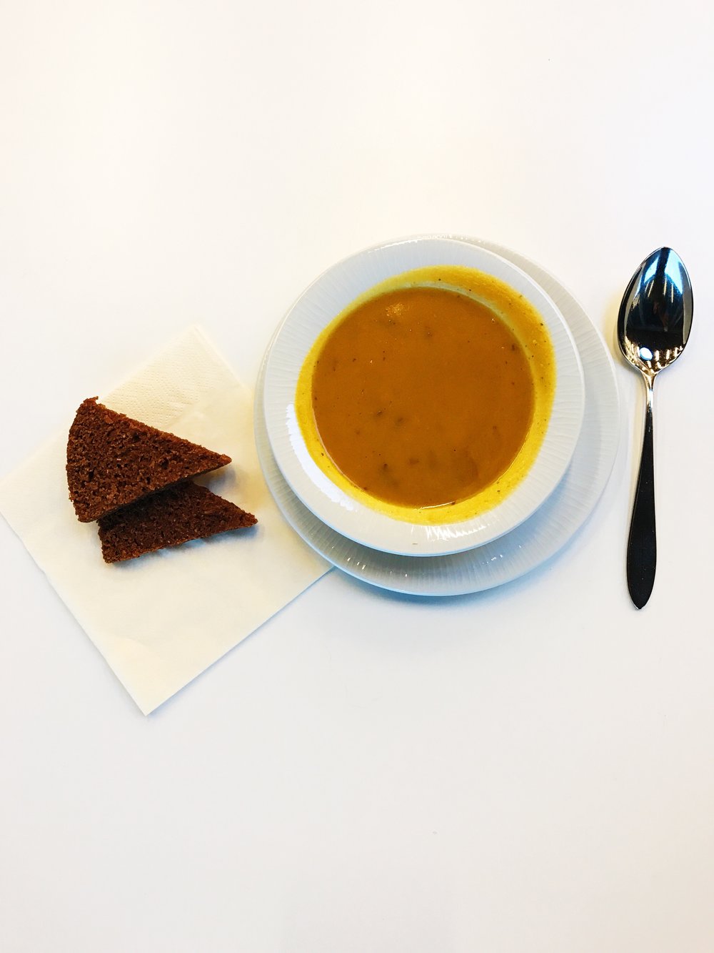 Coconut, carrot and ginger soup with a side of rye bread.
